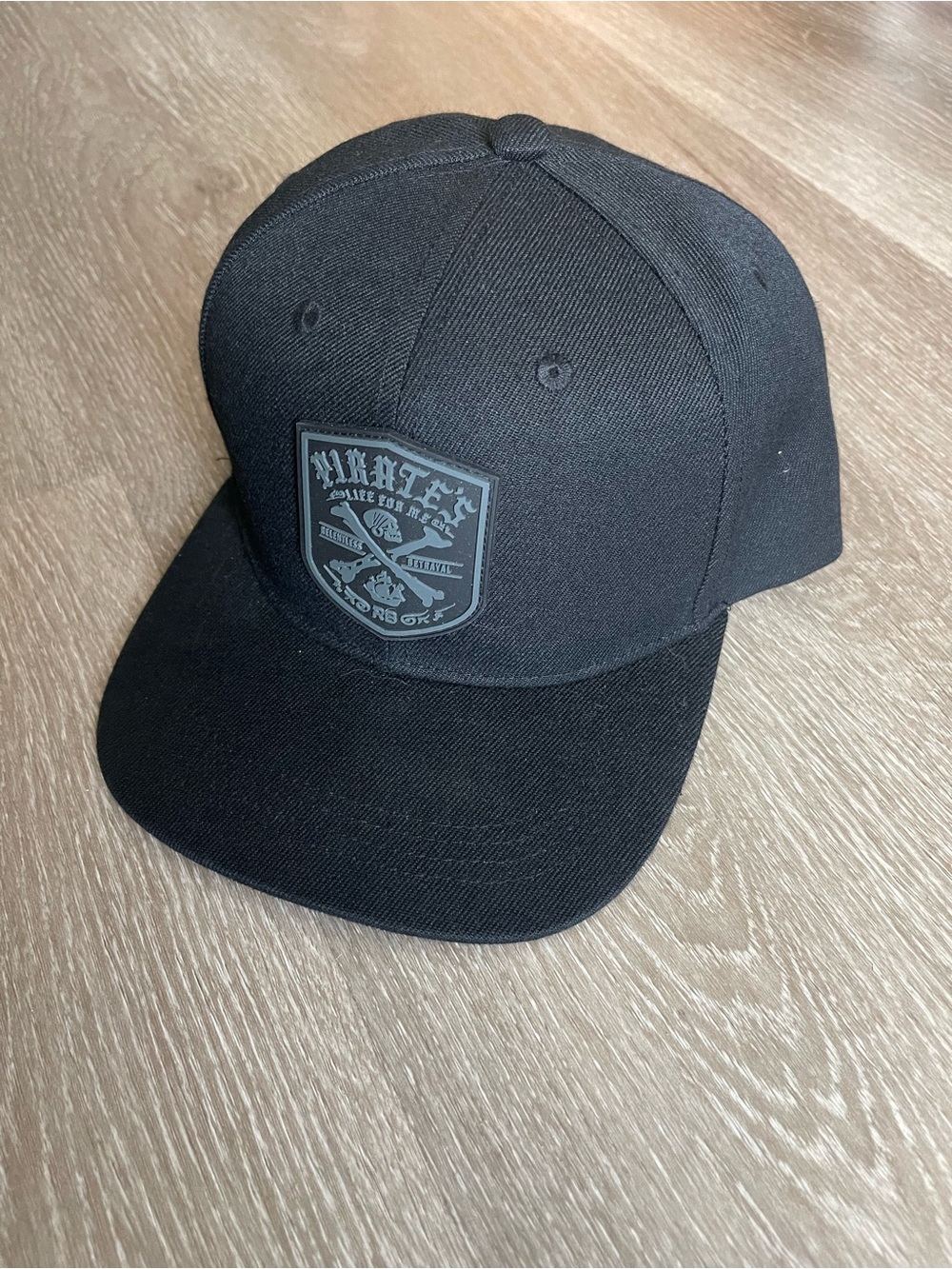 Relentless Betrayal Men's Black Snapback Hat with Raised Shield Patch